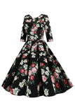 Svarte halvermer Blomstertrykt kjole fra 1950-tallet