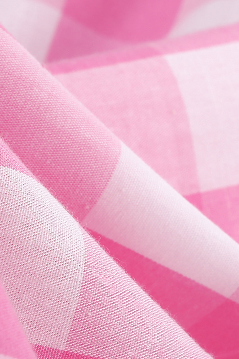 Rosa pin opp rutete vintagekjole fra 1950-tallet