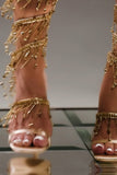Gyldne glitrende strappy høyhælte sandaler med dusk