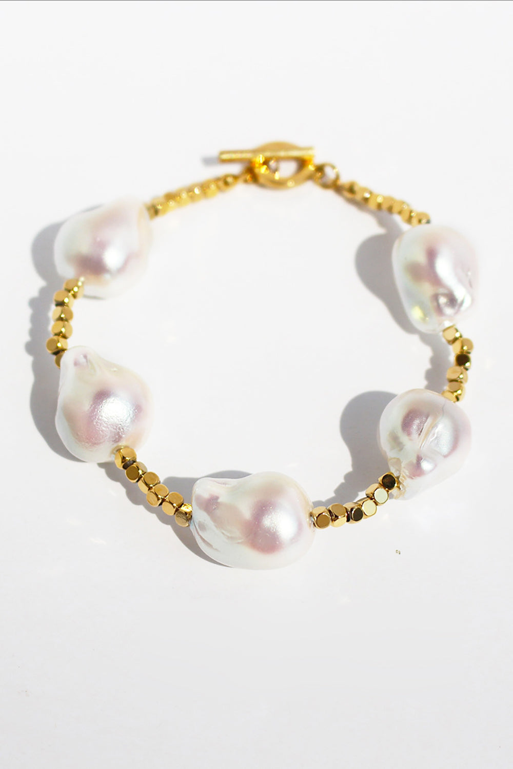 Formet Pearl Gold armbånd
