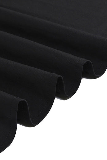 V-hals korte ermer rutete svart kjole fra 1950-tallet med belte