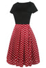 Load image into Gallery viewer, Båthalstrykt svart kjole fra 1950-tallet med korte ermer