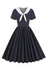 Load image into Gallery viewer, svart og hvit polka prikker vintage 1950-tallet kjole med bowknot