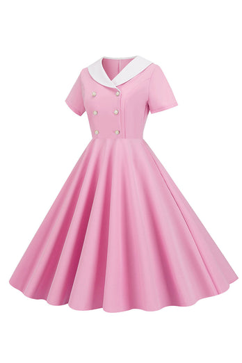 En linje rosa kortermet kjole fra 1950-tallet