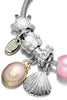 Load image into Gallery viewer, Rosa Sea Shell Charm Wrap Bangle armbånd